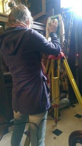 Figure 1: Iona Skyring using a total station, in the hall at Chawton House Library
