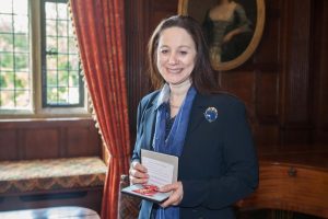 Dr Sandy Lerner with her OBE